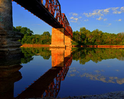 Over the Red River Carperter's Buff Bridge by Randall Watkins