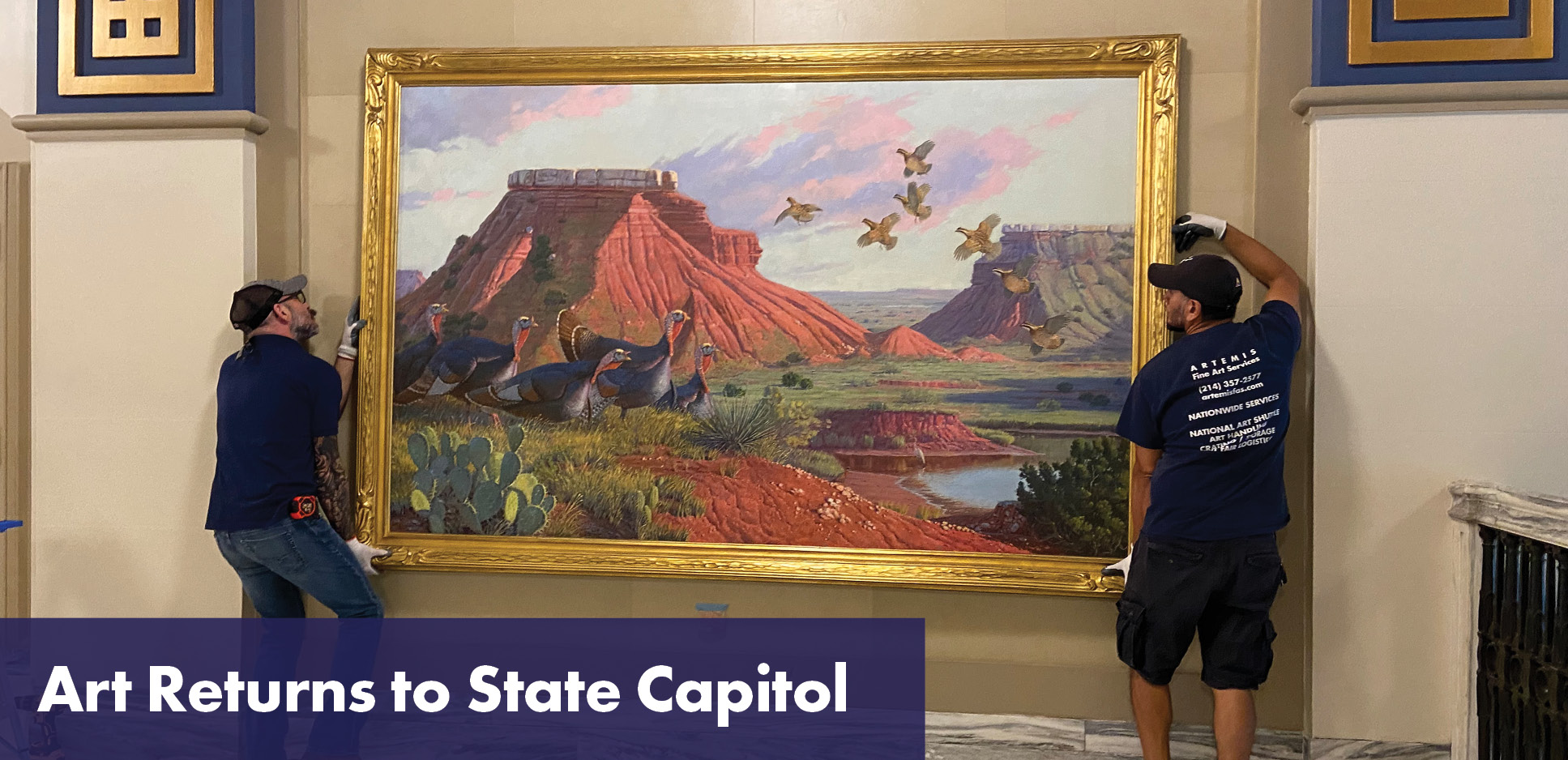 Art Returns to State Capitol. Two handlers installing a large painting.